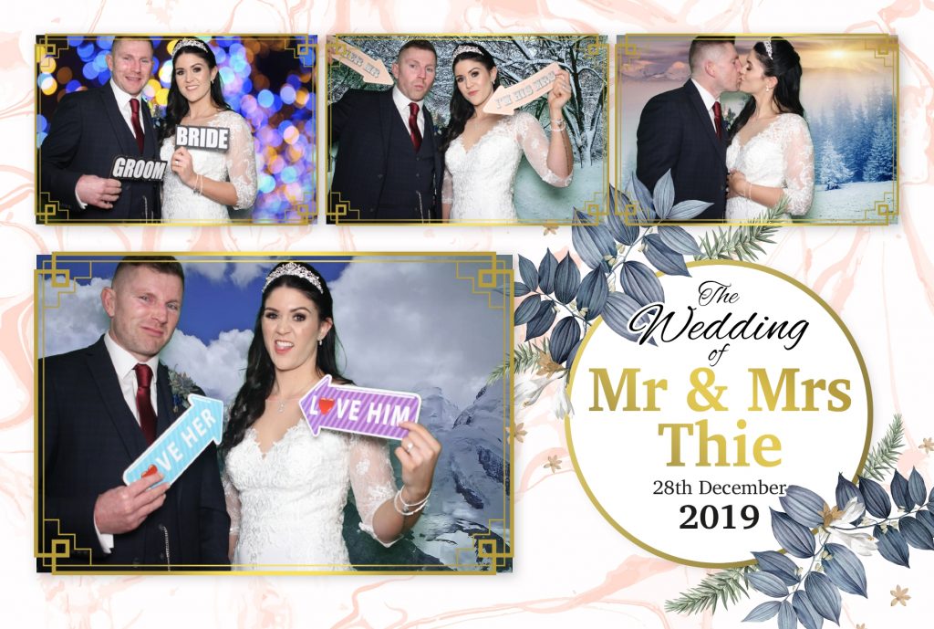 Happy couple in the photo booth with their chosen template design
