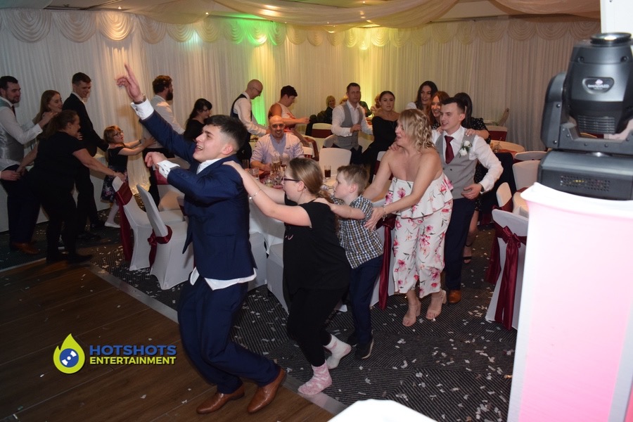 wedding guests doing the conga