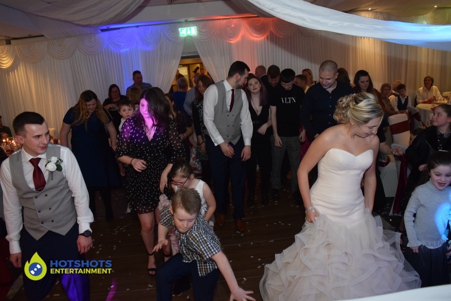 Wedding guests having a great time dancing.