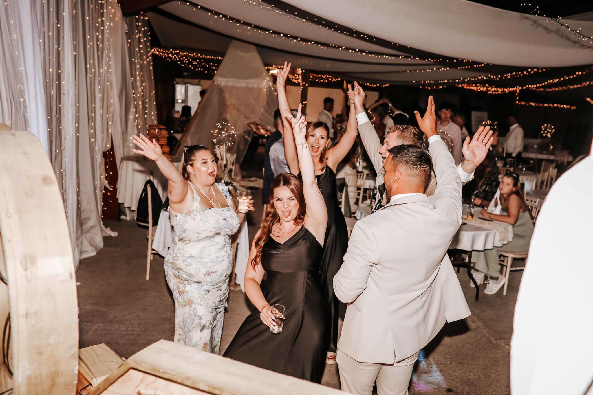 Wedding party with guests dancing the night away
